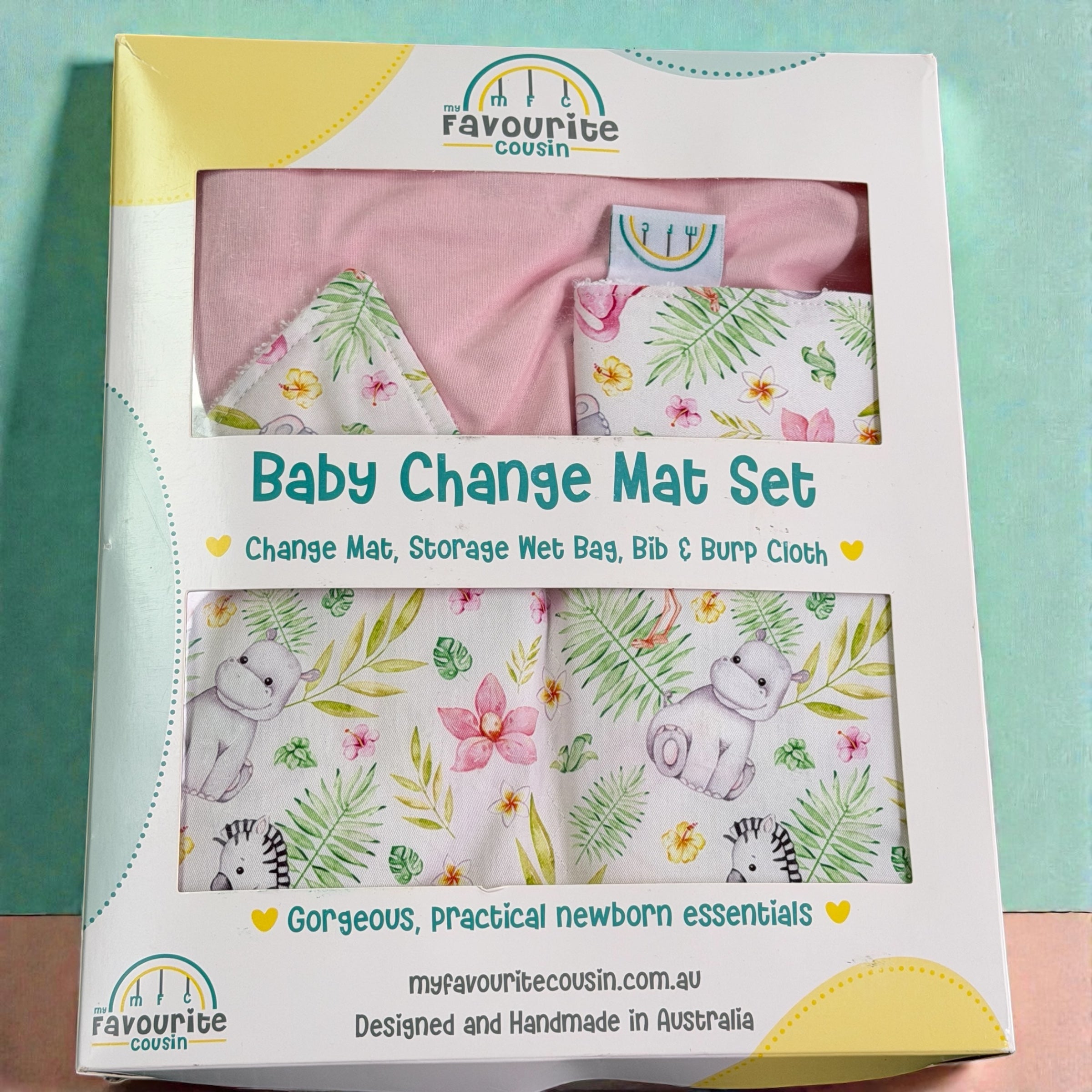 Baby change mat set with bib and burp cloth with floral jungle animal pattern pink fabric