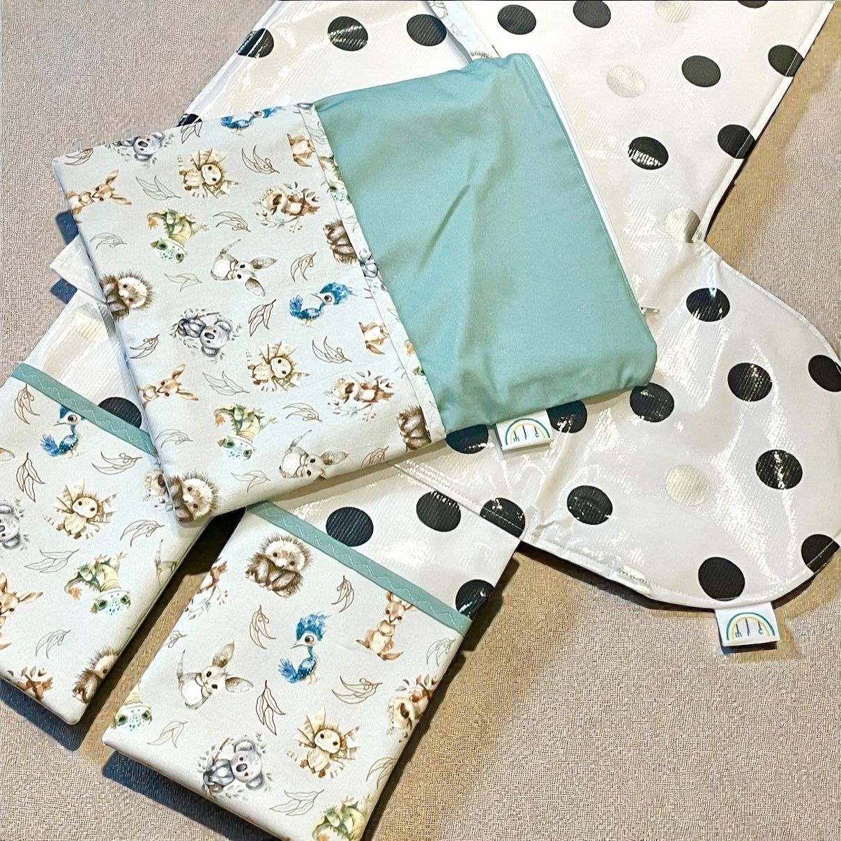an opened baby change mat with 2 pockets and storage bag