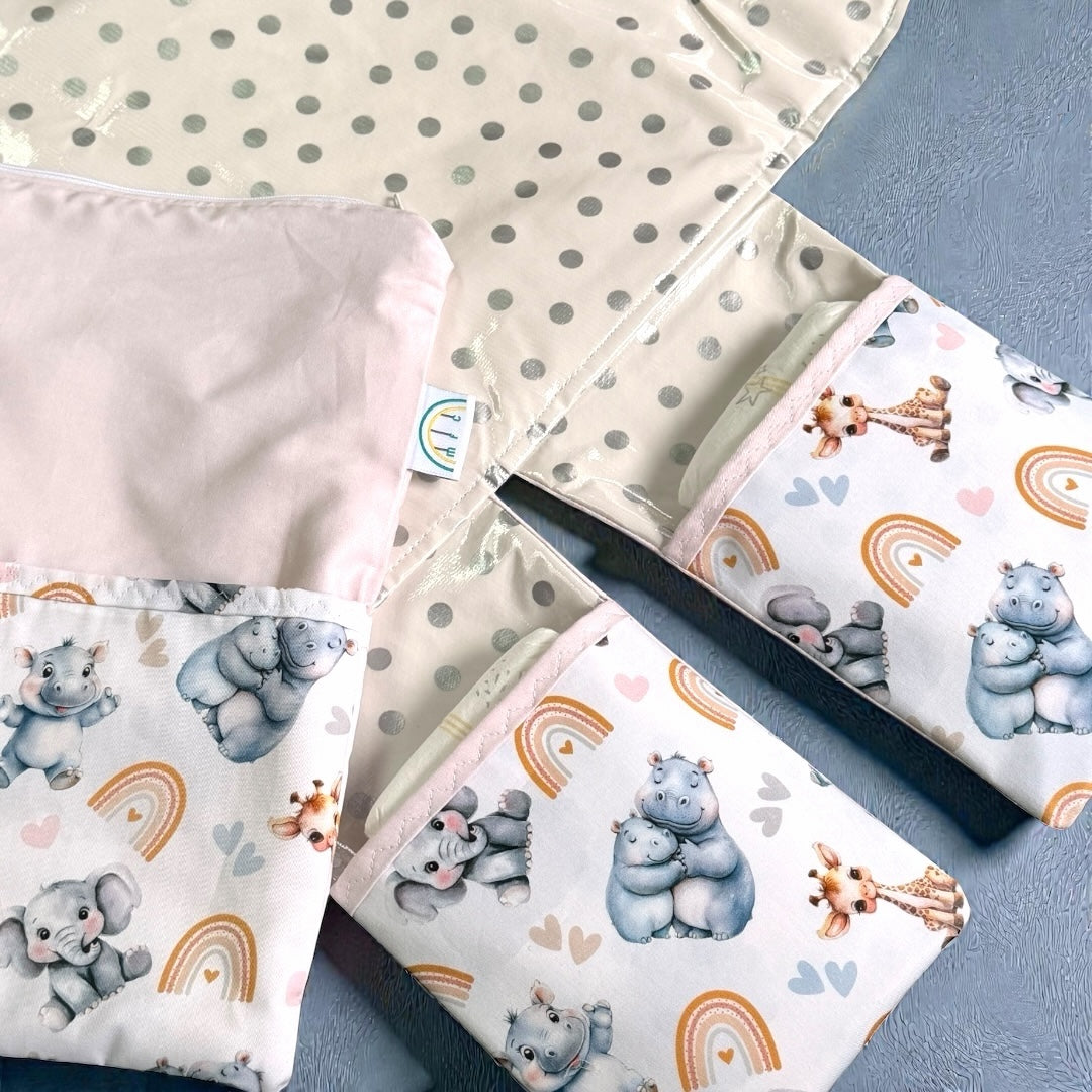 baby change mat with 2 pockets hippos elephants in pink
