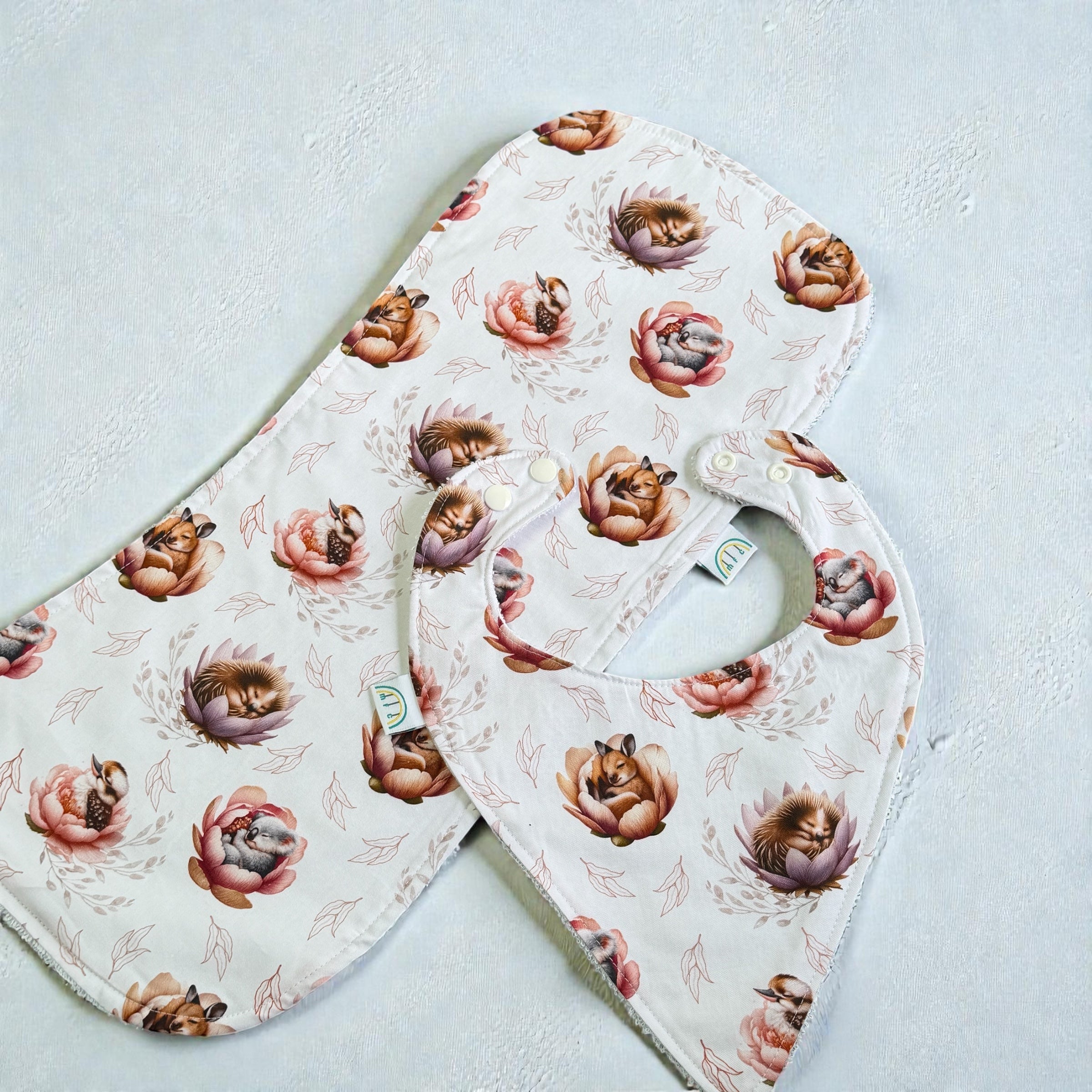 sleeping australian animals in native flowers bib and burp cloths 