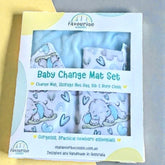 baby change mat set packaging with blue elephant and heart designs on a gray background