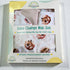 Baby change mat set packaging with floral design and text on a light background