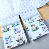 opened baby change mat with 2 pockets and jungle animal print