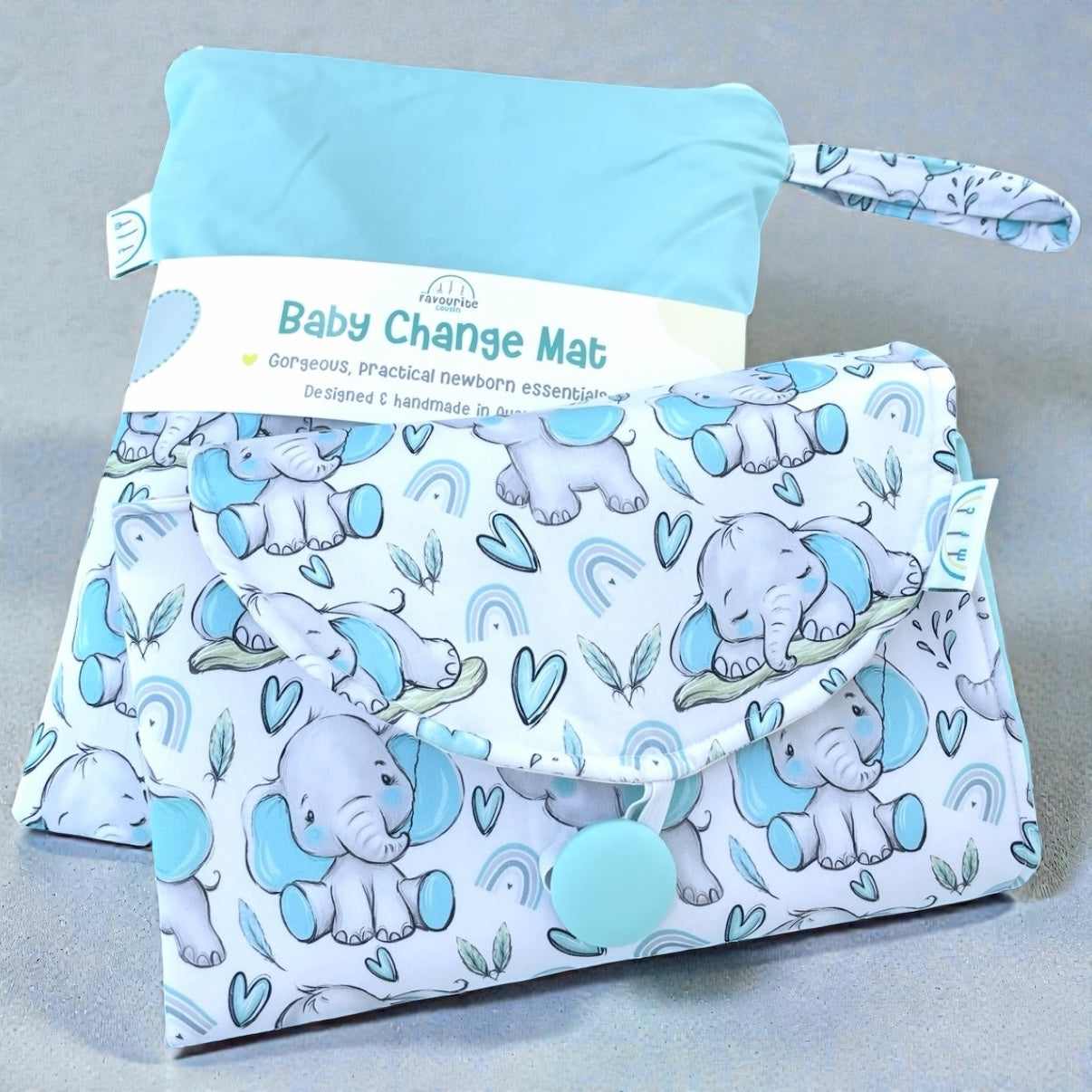 Baby change mat with elephant pattern on a gray background
