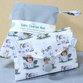 Baby change mat with jungle animal pattern on a beige background